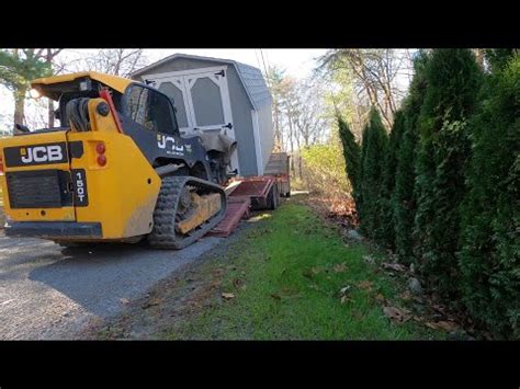 moving shed with skid steer|portable buildings on skids.